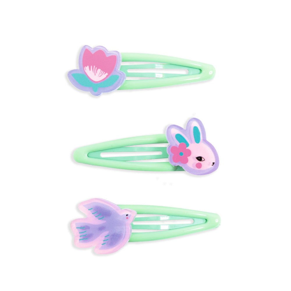 Three pastel green hair clips with floral designs on a white background