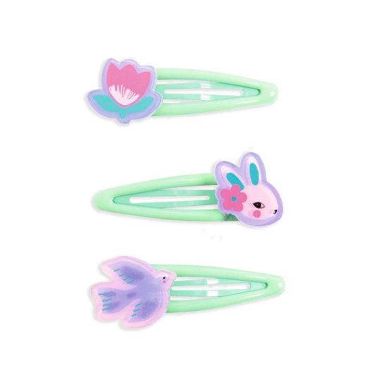 Three pastel green hair clips with floral designs on a white background