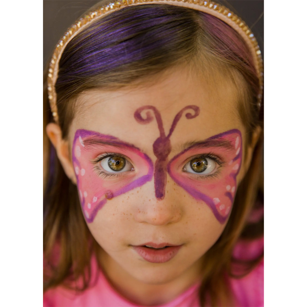 Young girl wearing One Two Play butterfly face paint with purple and pink wings and a sparkly headband
