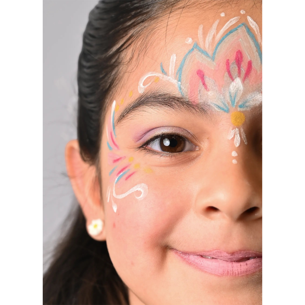 One Two Play Mermaid face paint kit applied in intricate pink, blue, and white floral designs on a young girl's face